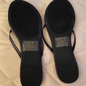 Black flip flops
